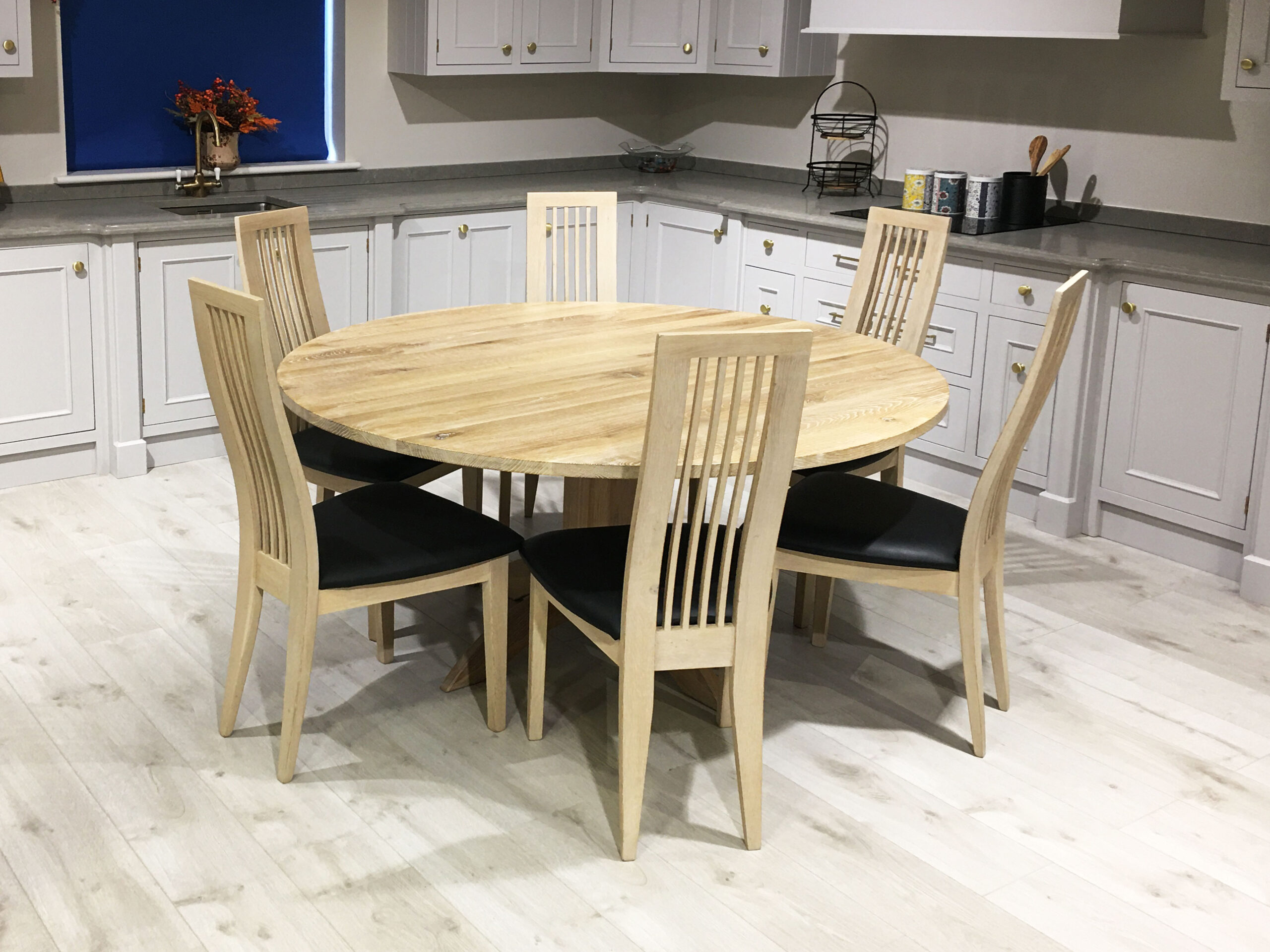 White washed oak round shop dining table